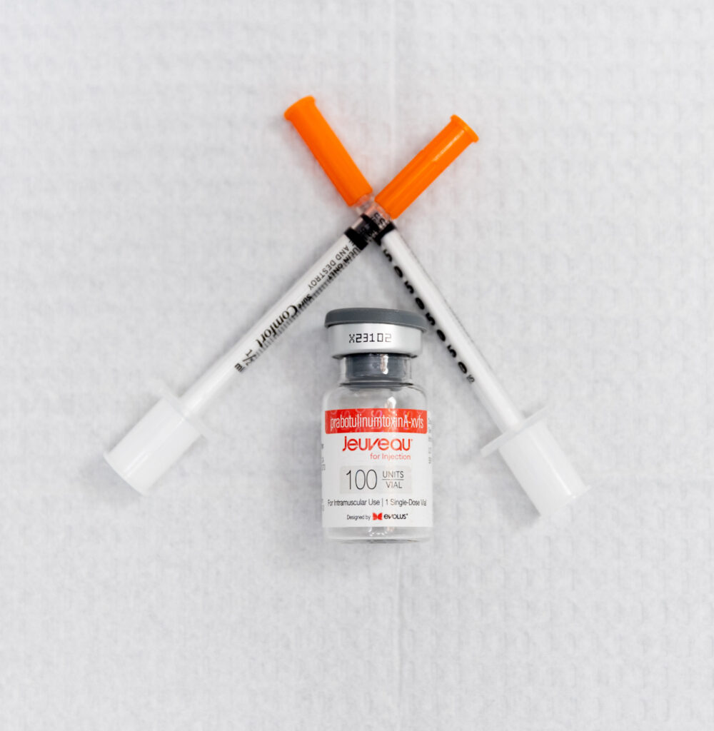 A close-up image of one of The Skin Clinic's most popular anti-aging treatments in Mankato, MN; Botox. A pair of syringes and a vial of the Botox sit on a sterile medical pad.